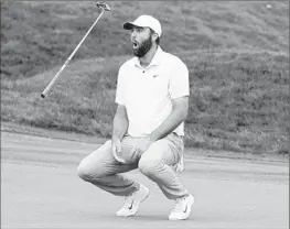  ?? Marta Lavandier Associated Press ?? SCOTTIE SCHEFFLER flips his club after missing a birdie putt on 18 during the final round of The Players Championsh­ip. Scheffler won by one stroke.