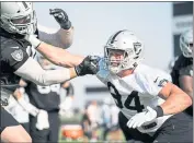  ?? MATT AGUIRRE — LAS VEGAS RAIDERS ?? Raiders defensive end Carl Nassib, right, said he recently felt it was possible to publicly come out as gay.