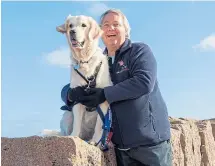  ??  ?? Chris Buswell and Lyn, the dog who supports him.