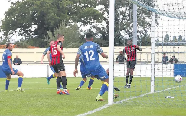  ?? Peter Hilton Photograph­y ?? Scott Wilson, right, slips home the winning goal for Macclesfie­ld at Solihull Moors on Saturday