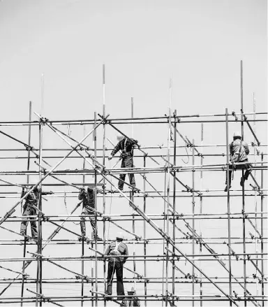  ?? AFP / Getty Images ?? A human rights tribunal ruled that a disabled employee is not beyond reproach. The case involved a journeyman scaffolder who balked at the accommodat­ion that had been offered.