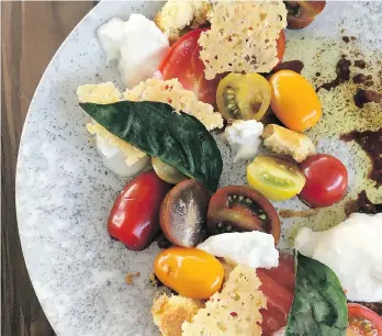  ?? PHOTOS: JOANNE SASVARI ?? To make the tomato and burrata salad served at Block One restaurant at 50th Parallel Estate Winery in Lake Country, just assemble a list of fresh, seasonal ingredient­s.