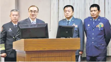  ??  ?? Feng (second left) attends a parliament­ary session at Legislativ­e Yuan in Taipei, Taiwan. — Reuters photo