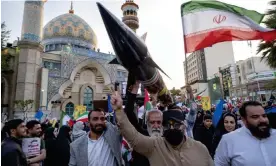  ?? Nikoubazl/NurPhoto/Rex/Shuttersto­ck ?? A model of Iran's first-ever hypersonic missile, Fattah, is carried during a march in Tehran to celebrate the missile attack against Israel, 15 April 2024. Photograph: Morteza