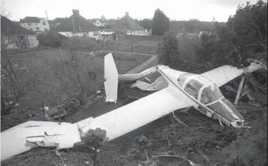  ??  ?? One of the damaged planes after high winds caused damage in 1990. Ref:132383-4