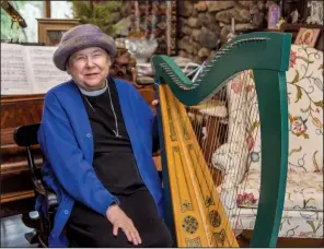  ?? (Arkansas Democrat-Gazette/Cary Jenkins) ?? “You put the harp right up against your body and you can feel the music in your body. It’s another way of feeling the music.”