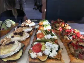  ?? JANET PODOLAK — THE NEWS-HERALD ?? A variety of fresh tapas are displayed for hungry visitors to Seville wanting to sample what’s available.