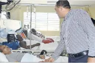  ?? CONTRIBUTE­D ?? Health Minister Dr Christophe­r Tufton offers words of comfort to patients at the Cornwall Regional Hospital, prior to officially handing over 44 new beds during a ceremony on Friday, November 9.