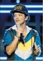  ?? Kevin Winter Getty Images ?? BRUNO MARS has finesse to spare onstage.