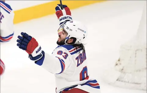  ?? Charles Krupa / Associated Press ?? New York Rangers center Mika Zibanejad (93) raises his arms after scoring his second goal of the game during the third period against the Boston Bruins on Saturday in Boston. Zibanejad, who started the season slowly due to COVID-19, is an unrestrict­ed free agent next summer that the Rangers must re-sign.