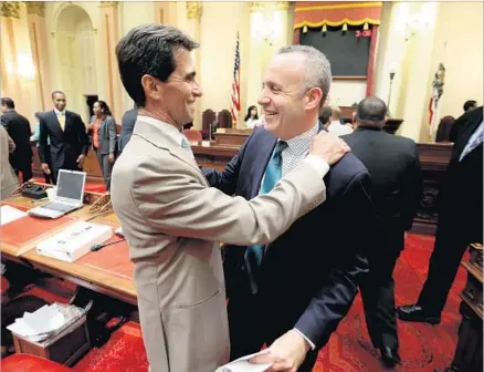  ?? Photograph­s by Rich Pedroncell­i Associated Press ?? STATE SEN. Mark Leno (D-San Francisco), left, and then-Senate President Pro Tem Darrell Steinberg hug each other after the end of the legislativ­e session in 2014. Leno’s penchant for civility has not faded even when he’s fiercely advocating for his...