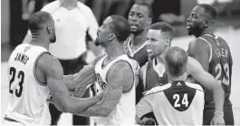  ?? JOSE CARLOS FAJARDO/STAFF ?? Cavs forward LeBron James, left, is held back by teammate J.R. Smith during a Game 4 altercatio­n with Warriors forward Draymond Green, right, who could face suspension.