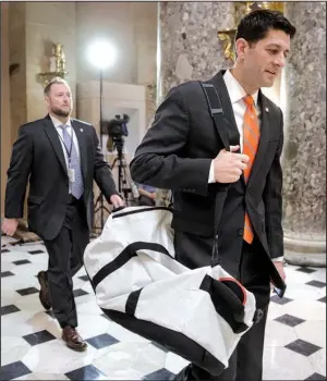  ?? AP/ J. SCOTT APPLEWHITE ?? House Speaker Paul Ryan heads to his office on Capitol Hill on Thursday as he and the Republican leadership scramble for votes on their health care overhaul.