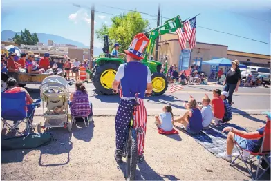  ??  ?? BELOW: Corrales’ 2017 Fourth of July parade saw village residents show up in all kinds of patriotic garb.