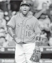  ??  ?? Astros third baseman Luis Valbuena is pleased with himself after his long throw to first beat the Angels’ Gregorio Petit to the bag during third-inning action.