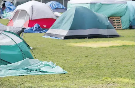  ?? ADRIAN LAM, TIMES COLONIST ?? Tents have been coming down this week at Topaz Park.