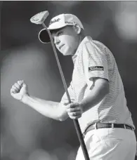  ?? By Chris Carlson, AP ?? Wonin two: Bill Haas gives a fist- pump after winning the Northern Trust Open at Riviera on the second hole of a playoff.