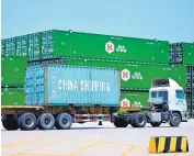  ?? ASSOCIATED PRESS ?? A truck moves a China Shipping shipping container at a port in Qingdao in eastern China’s Shandong Province earlier this week.