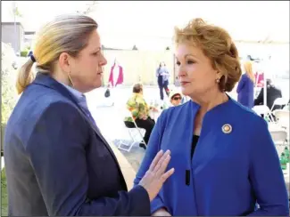  ?? The Sentinel-Record/Richard Rasmussen ?? FIRST ADVOCATE: Arkansas first lady Susan Hutchinson, right, greeted Karen Wright, director of the Cooper-Anthony Mercy Child Advocacy Center, Thursday during the center’s inaugural Child Abuse Prevention Rally and Luncheon. Hutchinson served as the...