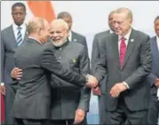  ?? AP ?? Russian president Vladimir Putin greets Turkey's President Recep Tayyip Erdogan (right) and Prime Minister Narendra Modi (centre) at the BRICS) summit meeting in Johannesbu­rg on Friday.