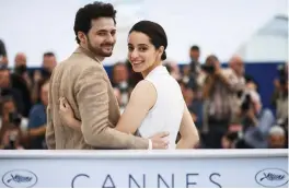  ??  ?? Egyptian director A.B Shawky (left) and producer Dina Emam pose during a photocall for the film “Yomeddine” at the 71st edition of the Cannes Film Festival in Cannes, southern France. — AFP