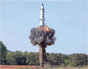  ?? AP ?? A North Korean Pukguksong-2 missile launches in a photo distribute­d in May.