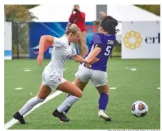  ?? STAFF PHOTO BY PATRICK MACCOON ?? Baylor senior midfielder Zoey Mize, left, makes a nice move on a CPA defender to get a shot off in the first half of Thursday’s TSSAA Division II-AA state semifinal at Chattanoog­a Christian School. Baylor won 2-1.