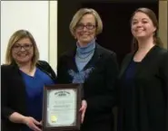  ?? SUBMITTED BY ELYRIA CITY SCHOOLS ?? From left, Ohio Auditor of State liaison Lindsay Kuhn presents the “Ohio Auditor of State Award with Distinctio­n,” to Elyria School’s Treasurer Joy Clickenger and assistant treasurer Anne Holton Feb. 21 in Elyria.