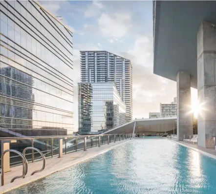  ??  ?? Miami nice Clockwise from right: greet the Miami sun at the urban-chic outdoor pool; the living and dining area in an apartment in Rise, one of the two residentia­l towers; hotel, offices and malls combine at Brickell City Centre; 43-storey towers offer...