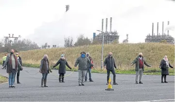  ??  ?? DRAWING THE LINE: The protesters stage their socially-distanced demonstrat­ion.