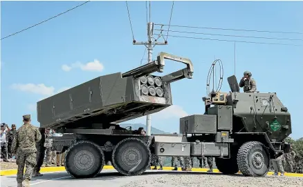  ?? GETTY IMAGES ?? Ukraine has used weapons such as the US long-range rocket system Himars to attack Russian ammunition dumps since the weapons started arriving in the war-torn nation.