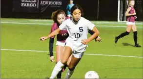  ?? Pete Paguaga / Hearst Connecticu­t Media ?? Staples’ Natalie Chudowsky fights for the ball during the FCIAC championsh­ip against St. Joseph at Kristine Lilly Field in Wilton on Nov. 3.