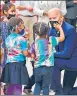  ?? AFP ?? US President Joe Biden greets children during a visit to a Covid vaccinatio­n clinic in Washington, DC.