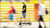  ?? Christina House Los Angeles Times ?? A SCOOTER rider on the boardwalk in Venice. Riding the vehicles on the sidewalk is illegal in California.