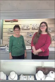  ?? Contribute­d ?? Sue Haney and Susan Willerson pose for a picture behind a counter at Haney Jewelry.