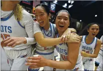  ?? JOSE CARLOS FAJARDO — STAFF ARCHIVES ?? St. Joseph’s Maila Lepolo (2), left, hugs teammate Talana Lepolo (10) after they defeated Cardinal Newman in their North Coast Section Open Division girls basketball final at St. Mary’s College in Moraga on Feb. 28, 2020.