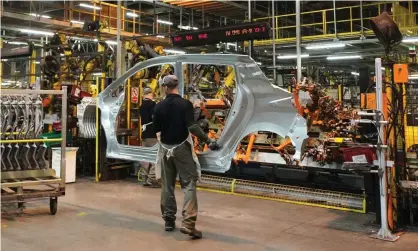  ??  ?? Workers on the production line at Nissan’s factory in Sunderland. Photograph: Owen Humphreys/PA