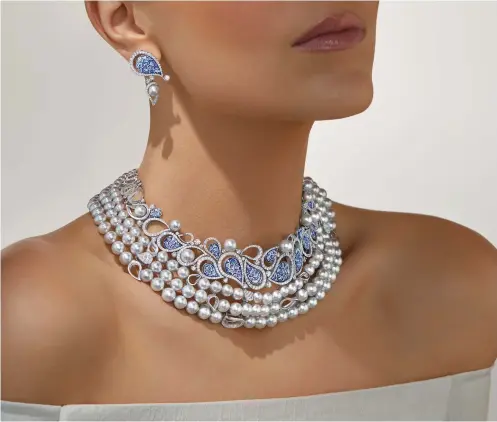  ??  ?? SICIS Jewels Calypso Blue Necklace in white gold with three strings of Akoya Light Blue pearls, diamonds, and micromosai­c drop motifs