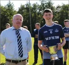  ??  ?? Wicklow Coiste na nÓg Chairman Pat Dunne with Michael Dwyers captain Ciaran Harmon after the game in Annacurra.