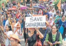  ?? PTI ?? Women hold placards as they participat­e in a protest on Saturday against the Supreme Court verdict that allowed entry of women of all ages to the Sabarimala temple.