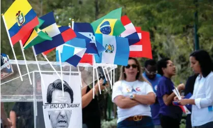  ?? Photograph: Cristóbal Herrera/EPA ?? Immigratio­n and human rights activists attend a rally and press conference against the relocation of migrants to Martha's Vineyard in Doral, Florida, in September 2022.