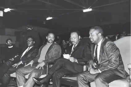  ?? Maurice Sorrell / Associated Press ?? Bernard Lee (left), Jesse Jackson, Martin Luther King Jr. and Ralph Abernathy in 1968 before King delivers a speech.