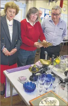  ?? FM4543725 ?? Fair organisers Margaret Smail, Morag Sharp and Robert Sharp see what treasures the stalls hold