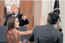  ??  ?? Donald Trump tells Jim Acosta (right) that “that’s enough” as the intern tries to take the microphone from him.