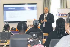  ?? STAFF PHOTO BY JOHNATHON CLINKSCALE­S ?? Charles County Public Schools Safety and Security Director Jason Stoddard speaks to parents and kids during a bullying prevention event on Saturday hosted by Beyond the Classroom Inc. at the Waldorf West Library.