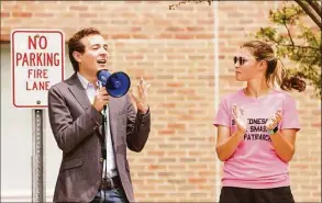  ?? Patrick Sikes / For Hearst Connecticu­t Media ?? State Sen. Will Haskellc, D-Westport, speaks about reproducti­ve rights next to Darien High School senior Livie Punishill during a Saturday abortion-rights rally.