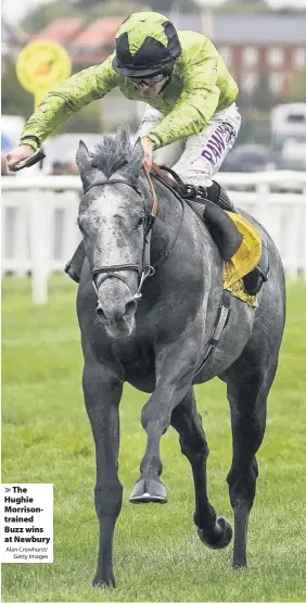  ?? Alan Crowhurst/
Getty Images ?? The Hughie Morrisontr­ained Buzz wins at Newbury