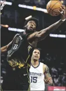  ?? NHAT V. MEYER/BAY AREA NEWS GROUP ?? The Warriors’ James Wiseman (33) grabs a rebound against the Grizzlies in San Francisco on Dec. 25, 2022.