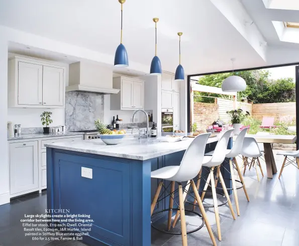  ??  ?? KITCHEN Large skylights create a bright linking corridor between here and the living area. Eiffel bar stools, £119 each, Dwell. Oriental Basalt tiles, £90sq m, J&amp;R Marble. Island painted in Stiffkey Blue estate eggshell, £60 for 2.5 litres, Farrow &amp; Ball