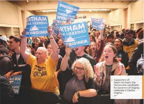  ?? AFP ?? Supporters of Ralph Northam, the Democratic candidate for Governor of Virginia, celebrate in Fairfax, Virginia.